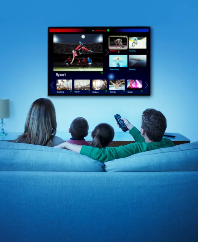 a family watching tv in living room